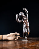 19th Century Ebonised Carved Putto - Harrington Antiques