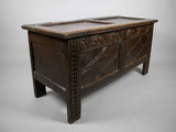 Antique 17th Century Carved Oak Coffer With Raised Legs & Original Iron Loop Hinges. - Harrington Antiques
