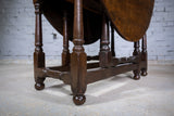 Early 18th Century English Oak Gate Leg Table With Central Drawer. - Harrington Antiques