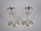 Pair Of Sterling Silver Neoclassical Candlesticks by Charles Boyton & Sons, 1911. - Harrington Antiques