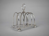 Sterling Silver Five Bar Toast Rack by William Hutton & Sons, Sheffield, 1907. - Harrington Antiques