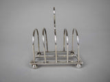 Sterling Silver Five Bar Toast Rack by William Hutton & Sons, Sheffield, 1907. - Harrington Antiques