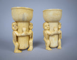 Unusual Pair of 19th Century Carved Bone Cherub Candle Holders. - Harrington Antiques